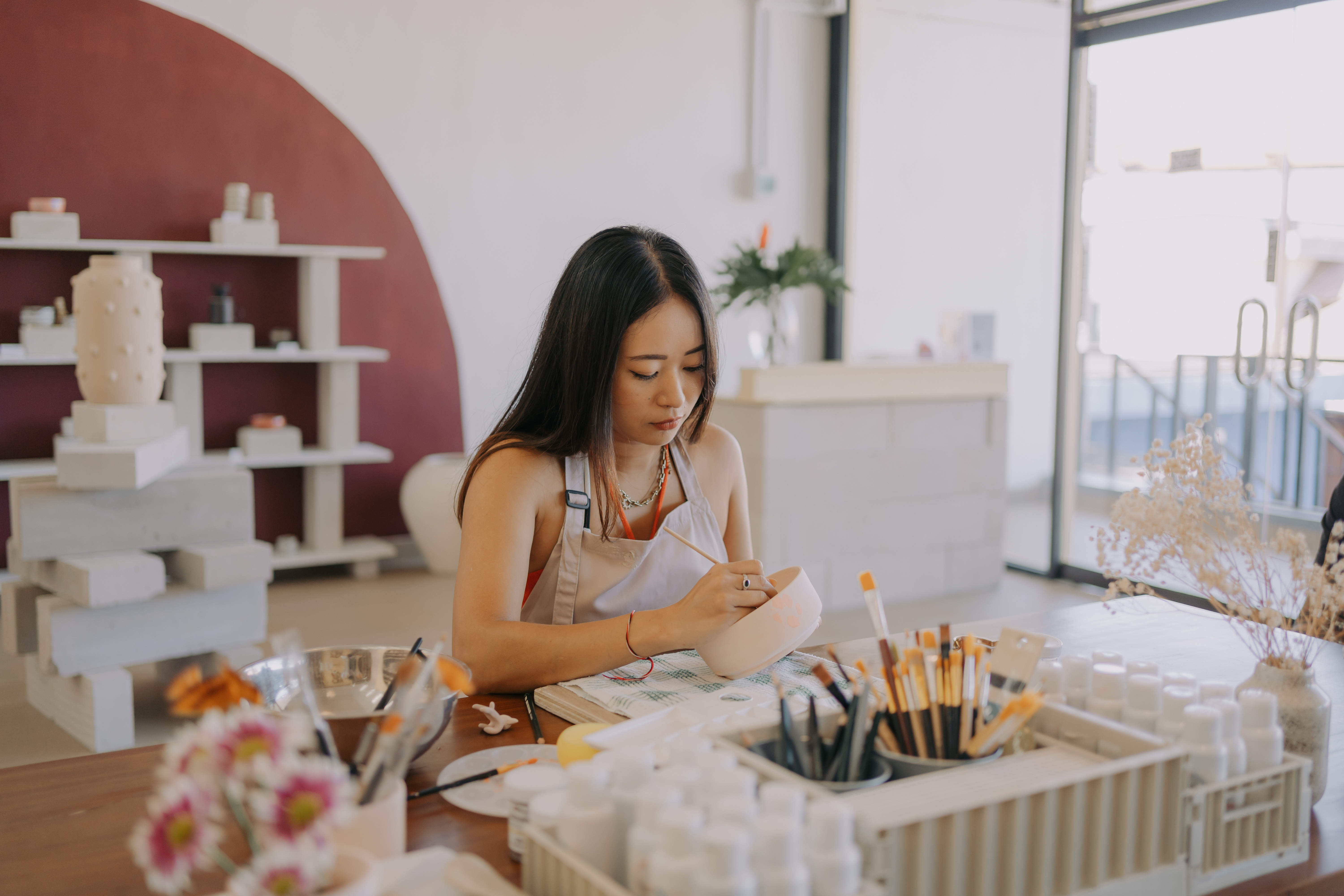 Guest painting ceramics at Mud House