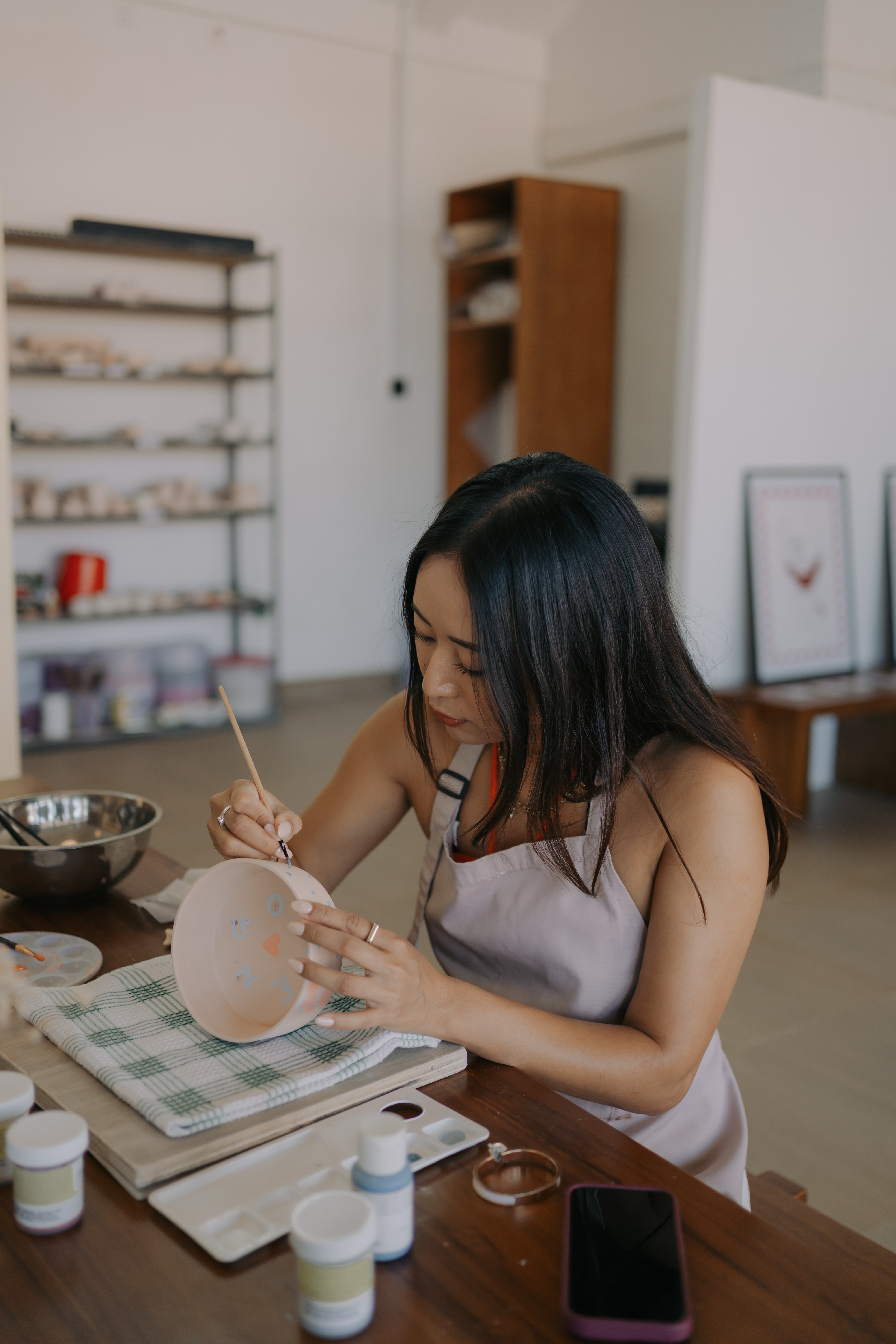 Guest painting ceramics at Mud House