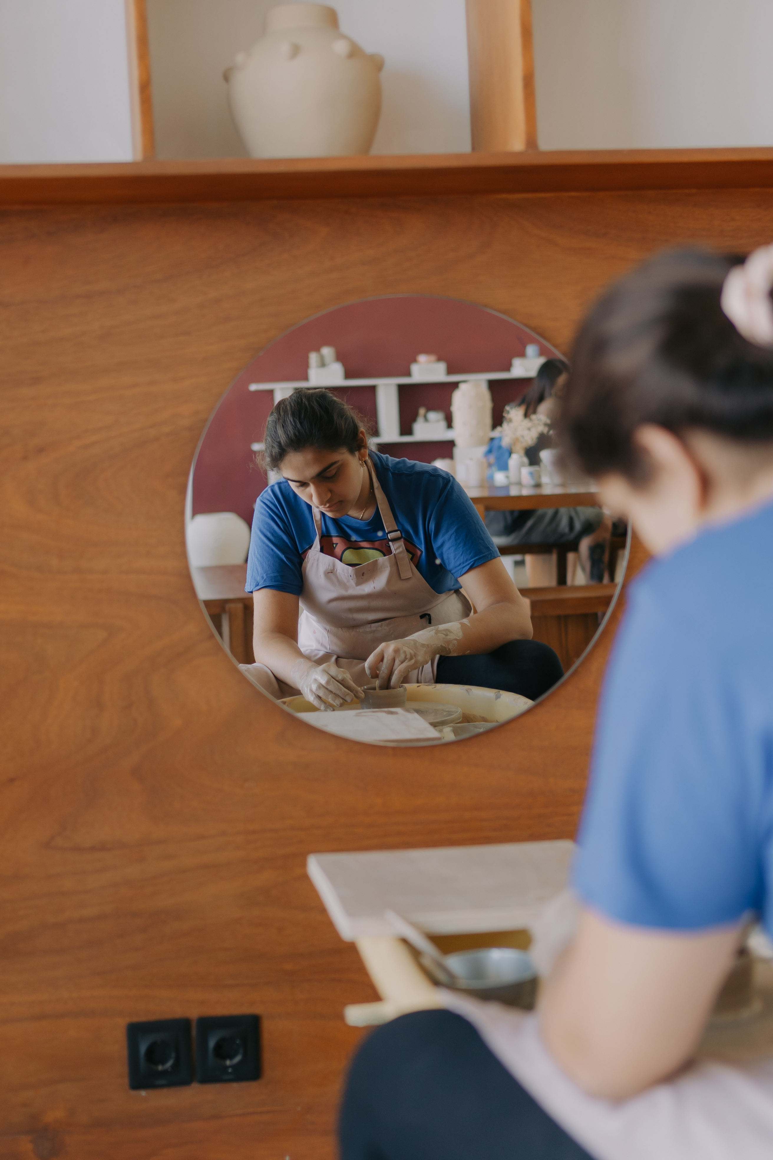 Close-up of hand building at Mud House